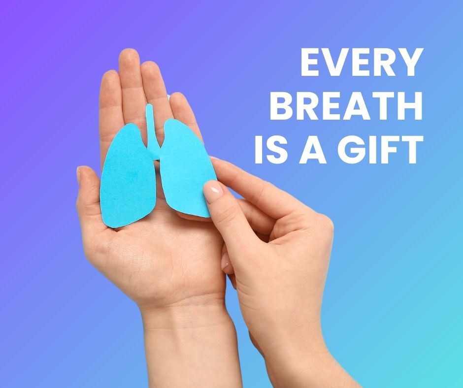 White text, Every breath is a gift. A blue paper cut-out of lungs being held flat in the left hand of a woman, and her holding the right side of the cut-out with her right hand.